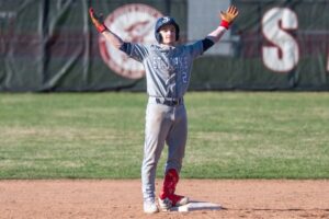 St. John's Prep's Brady Baldassare celebrates his double against St. John's Shrewsbury. (Patrick Donnelly/NEBJ)